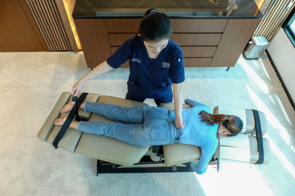 chiropractor performing Osso Flexion Distraction Adjustment Technique®️